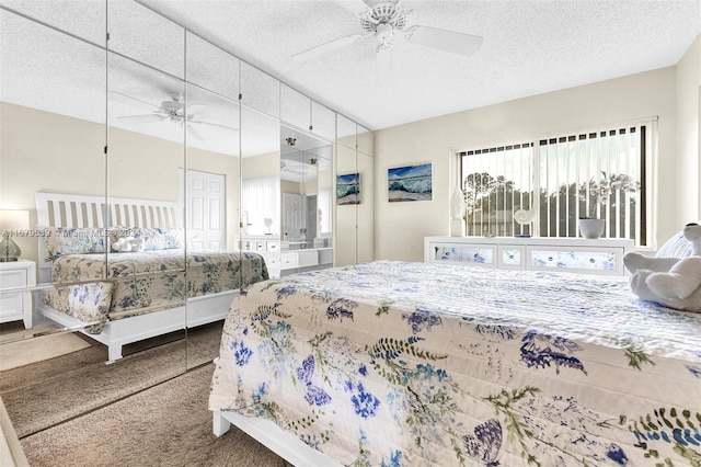 bedroom with carpet, a textured ceiling, a closet, and ceiling fan