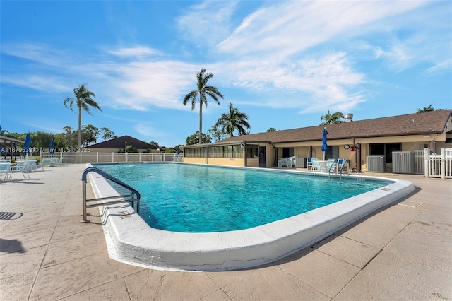 442 Pine Glen Ln Unit D-2, Green Acres, FL 33463 - community pool featuring fence, a patio, and cooling unit