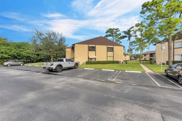 442 Pine Glen Ln Unit D-2, Green Acres, FL 33463 - view of uncovered parking lot