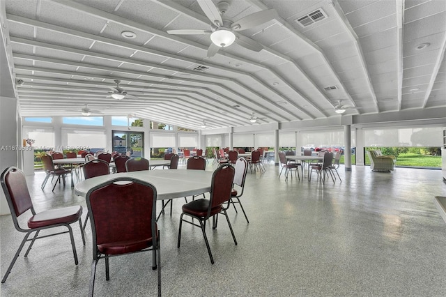 dining area featuring ceiling fan and lofted ceiling