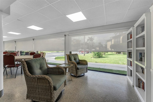 sunroom / solarium featuring a paneled ceiling