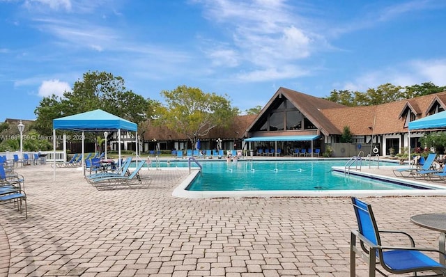 view of swimming pool featuring a patio