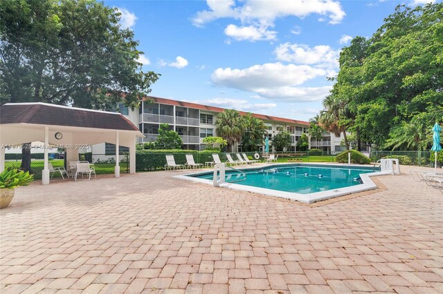 view of swimming pool with a patio