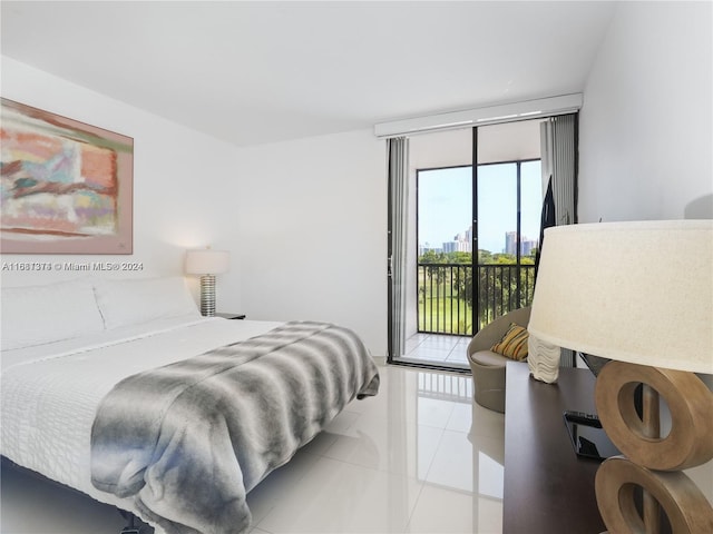 bedroom with access to exterior and light tile patterned floors