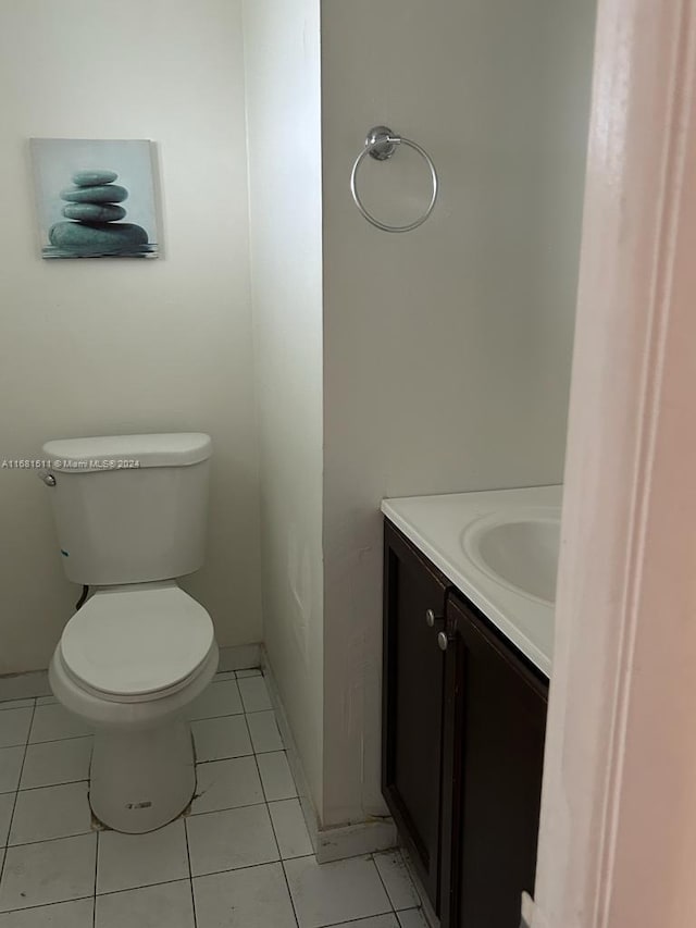 bathroom featuring vanity, toilet, and tile patterned floors