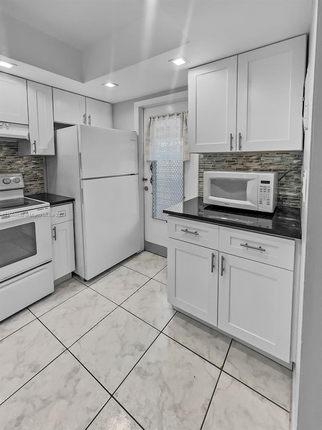 kitchen with white appliances, white cabinetry, decorative backsplash, and ventilation hood