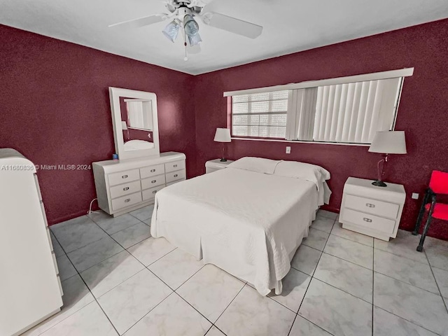 bedroom with light tile patterned floors and ceiling fan