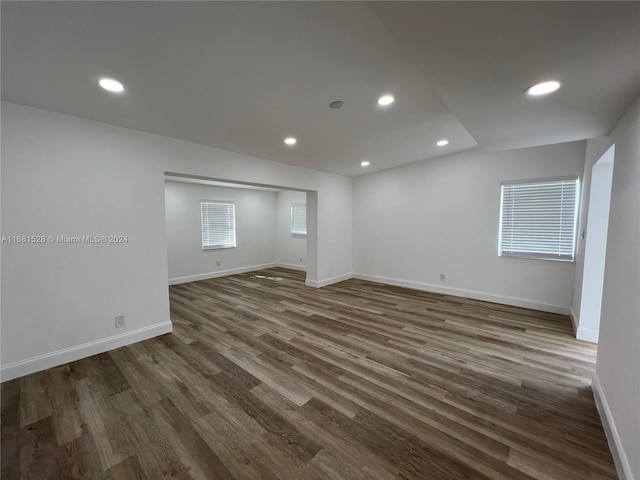 unfurnished room featuring dark hardwood / wood-style flooring