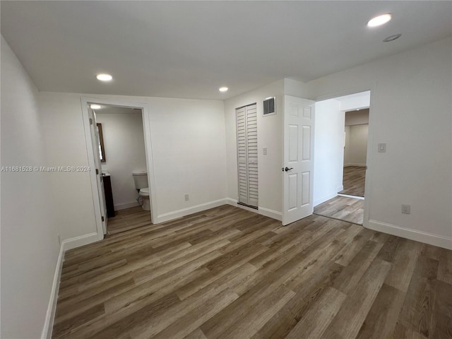 unfurnished room featuring dark wood-type flooring