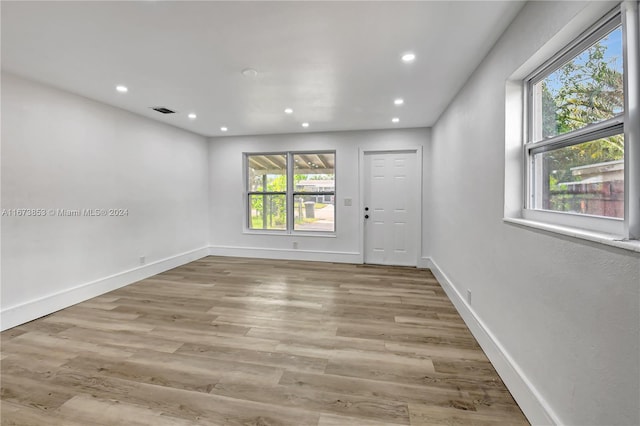 unfurnished room with plenty of natural light and light wood-type flooring