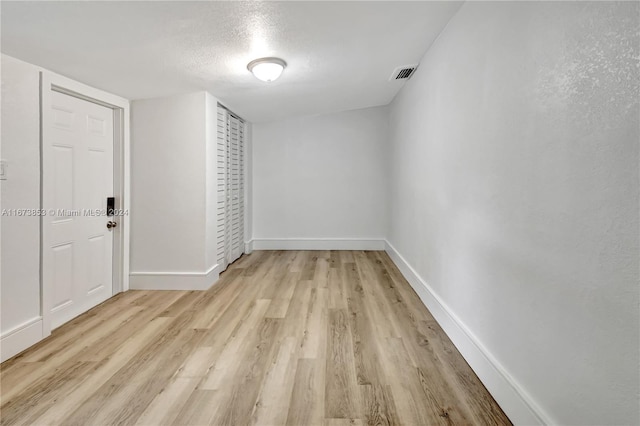 spare room with light hardwood / wood-style flooring