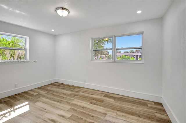 spare room featuring light hardwood / wood-style flooring