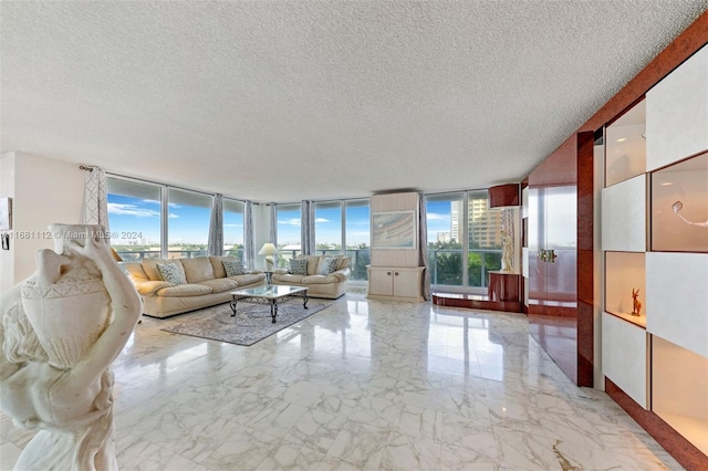 unfurnished living room with a healthy amount of sunlight, expansive windows, and a textured ceiling