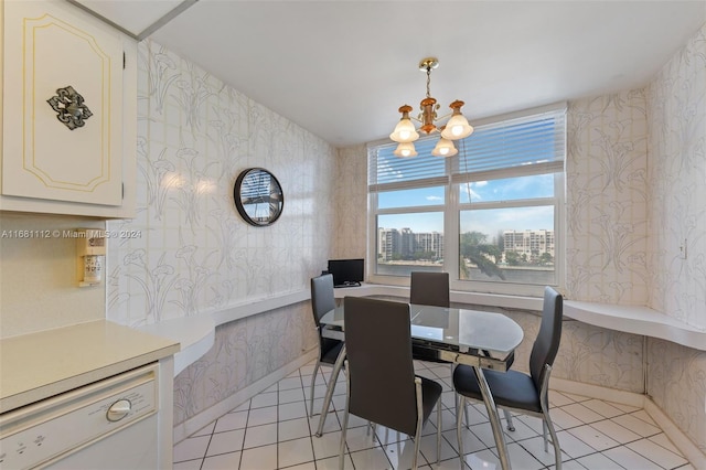 tiled dining area with a notable chandelier