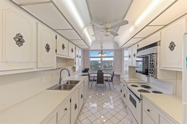 kitchen with white cabinets, sink, light tile patterned floors, and white range with electric cooktop