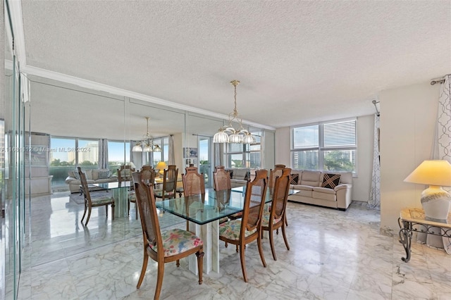 dining room with a chandelier and a textured ceiling