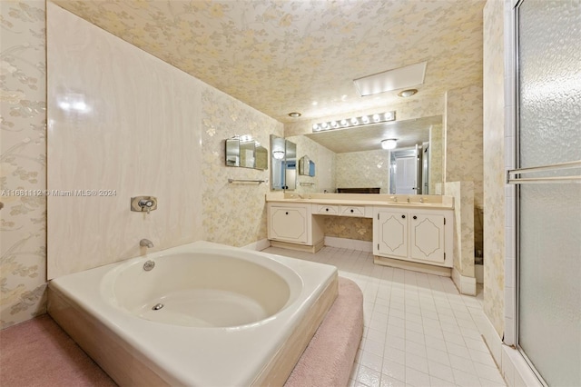 bathroom featuring vanity, independent shower and bath, and tile patterned flooring