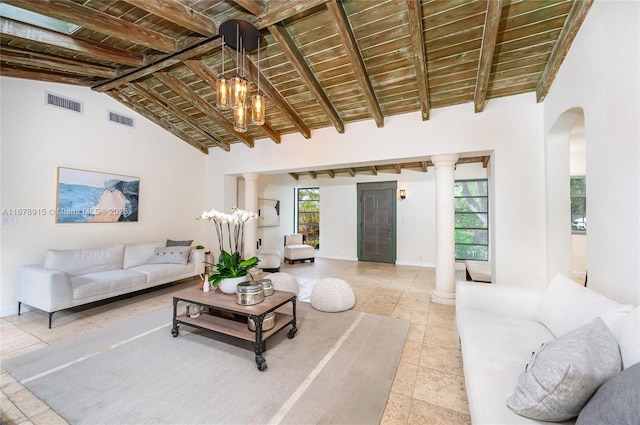 living room with beamed ceiling, a healthy amount of sunlight, wooden ceiling, and high vaulted ceiling