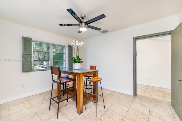 dining room featuring ceiling fan