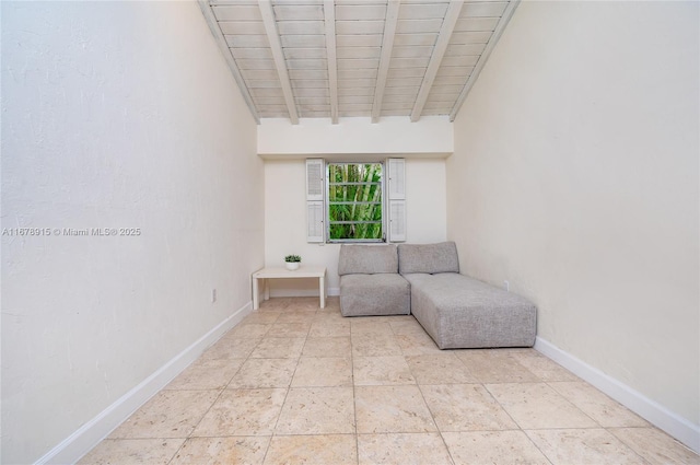 unfurnished room with beam ceiling and wood ceiling