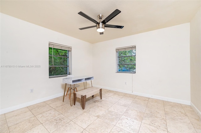 unfurnished room with ceiling fan