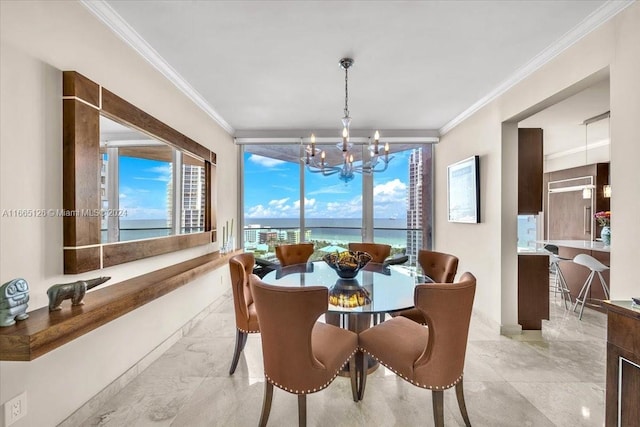 dining space with a water view, crown molding, and an inviting chandelier