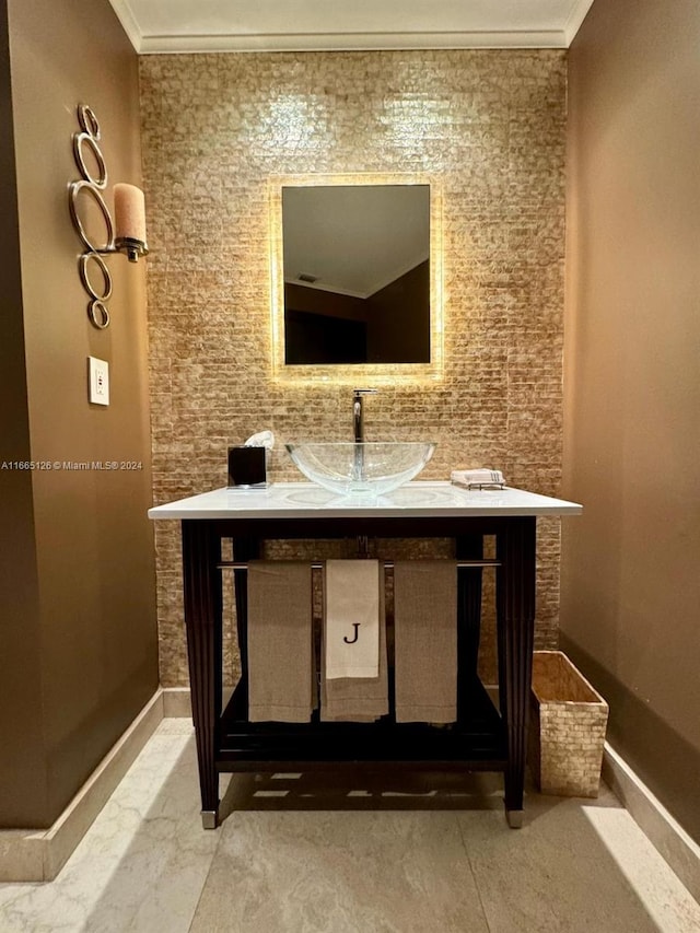 bathroom featuring vanity and ornamental molding