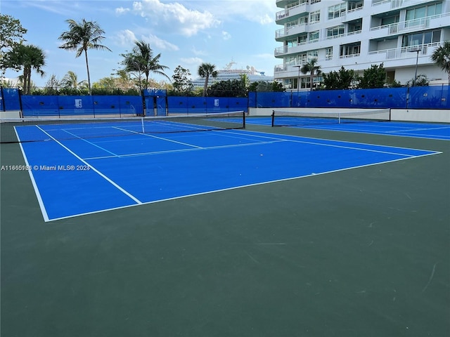 view of sport court featuring basketball hoop