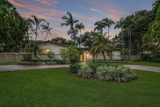 view of front of house with a lawn