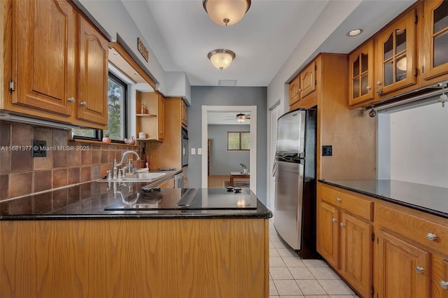 7901 SW 133rd St, Pinecrest, FL 33156 - kitchen featuring freestanding refrigerator, wall oven, healthy amount of natural light, and decorative backsplash