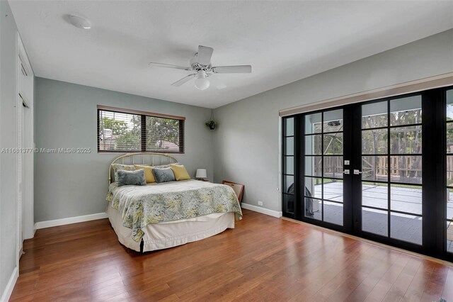 7901 SW 133rd St, Pinecrest, FL 33156 - bedroom with wood finished floors, french doors, access to exterior, and a ceiling fan