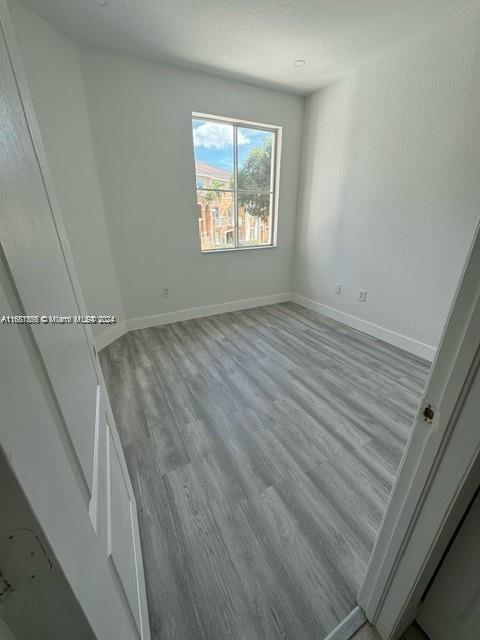 spare room featuring light hardwood / wood-style floors