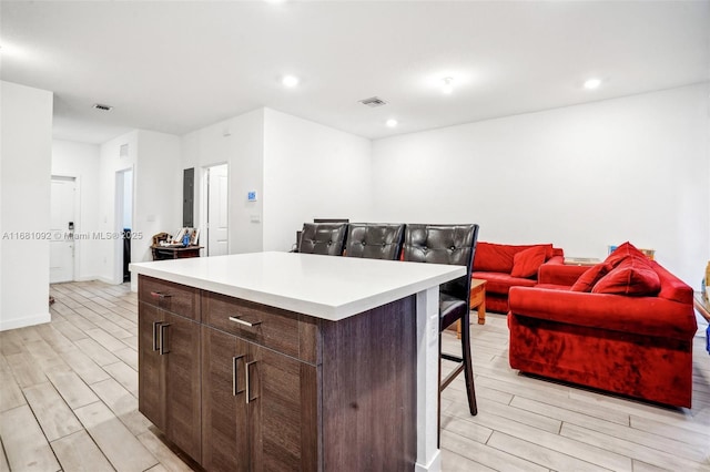 kitchen featuring a center island and a kitchen breakfast bar