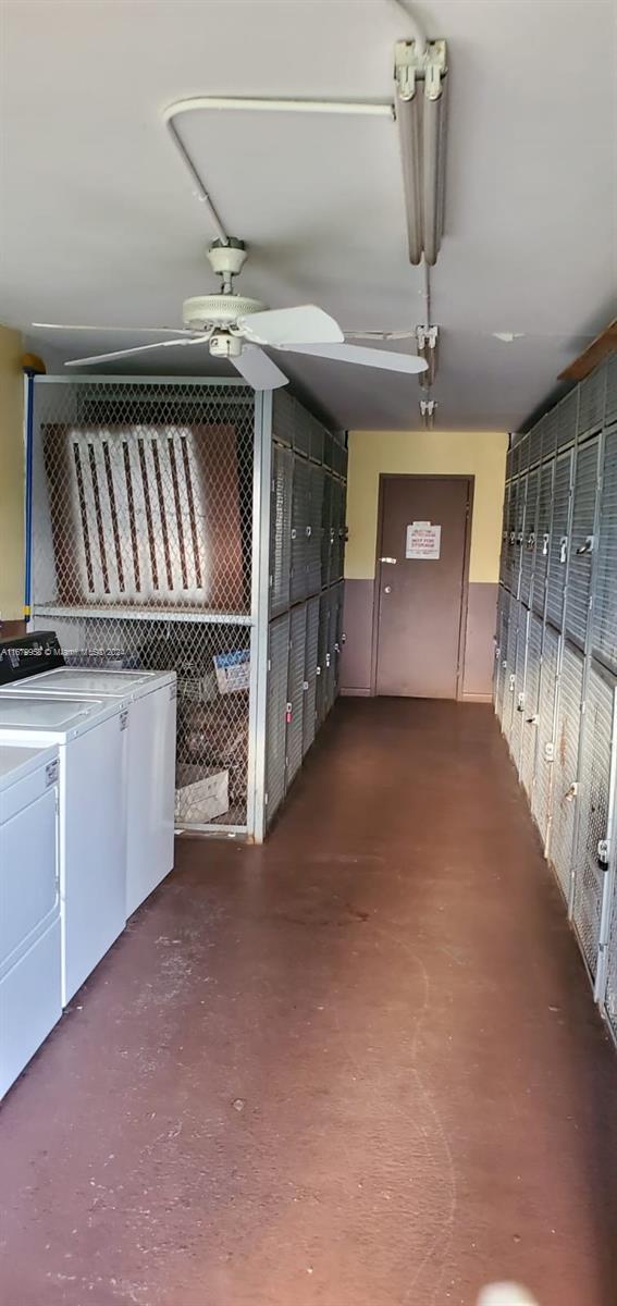 basement with washing machine and dryer and ceiling fan