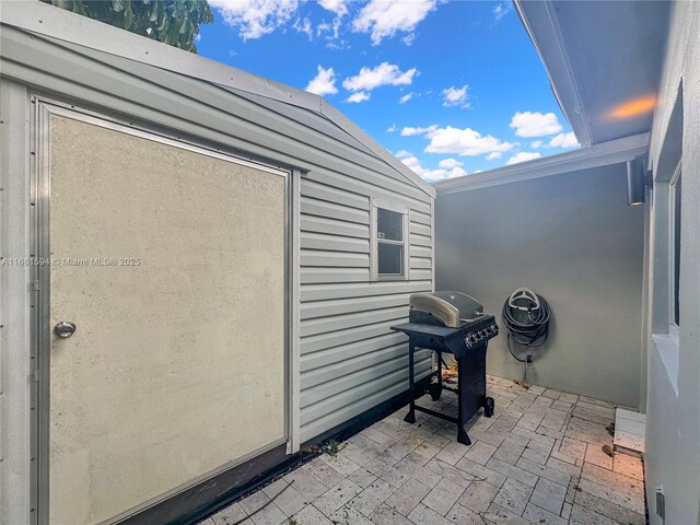 view of patio featuring a grill