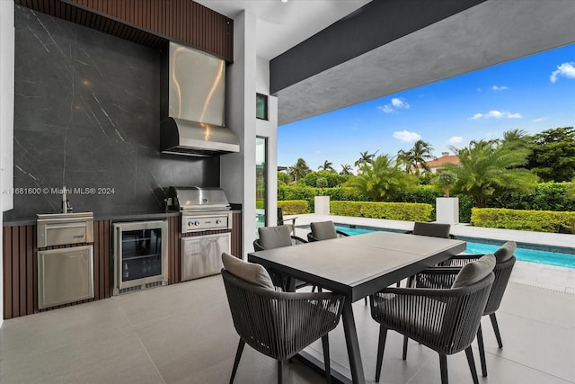 view of patio / terrace featuring wine cooler, exterior kitchen, and grilling area