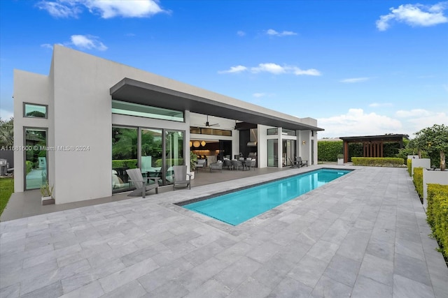 view of pool featuring a patio and outdoor lounge area