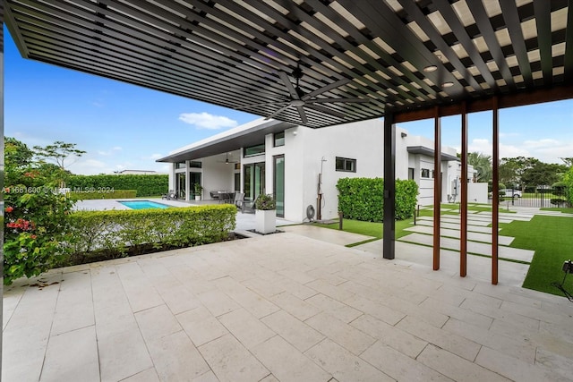 view of patio with ceiling fan and a fenced in pool