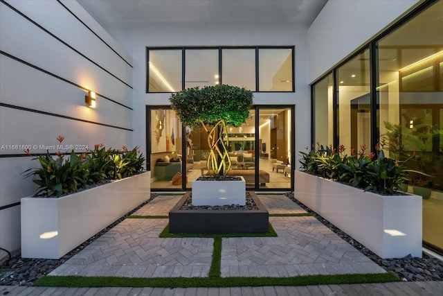 doorway to property with a patio area