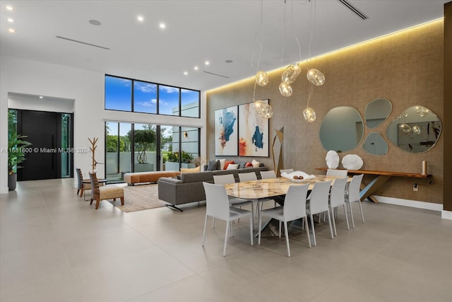 dining room with a high ceiling