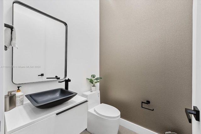 bathroom with vanity and toilet