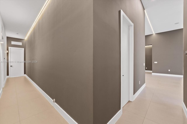 corridor with light tile patterned floors