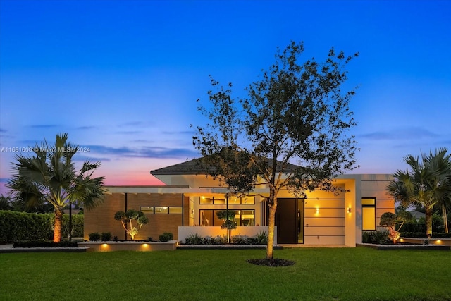 view of front of house with a lawn