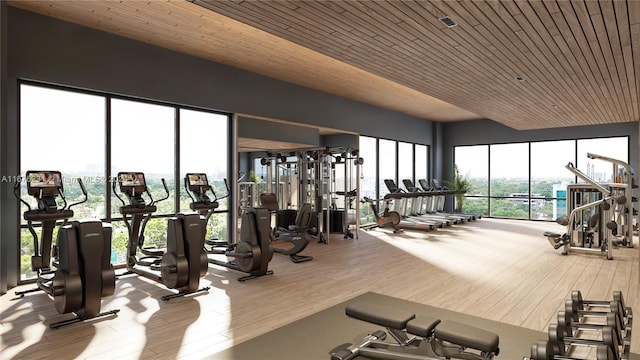 workout area featuring light hardwood / wood-style floors and wooden ceiling