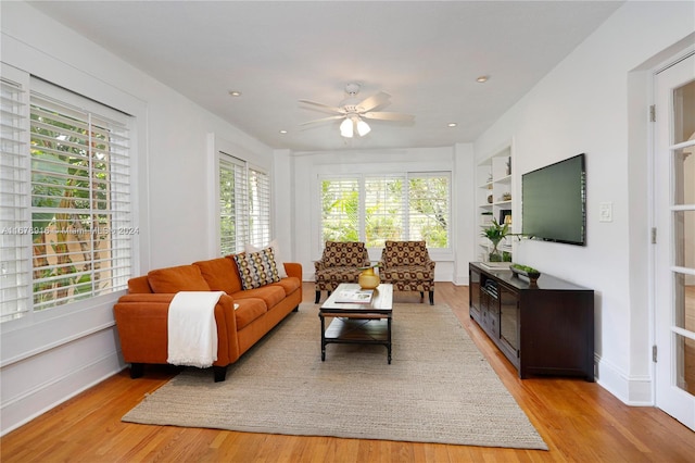 living room with plenty of natural light and light wood-type flooring