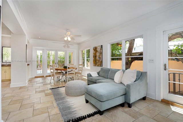 sunroom / solarium with french doors, ceiling fan, a healthy amount of sunlight, and sink