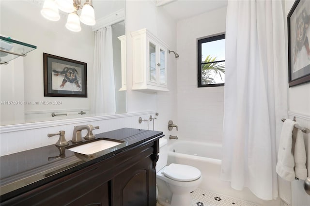 full bathroom with toilet, tile patterned flooring, vanity, a chandelier, and shower / bathtub combination with curtain