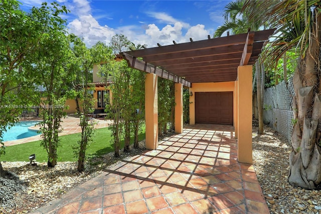 view of patio with a fenced in pool and a pergola