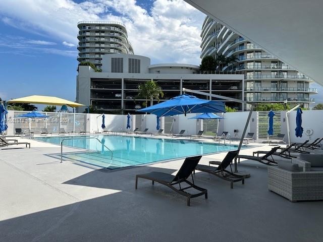 view of swimming pool featuring a patio area