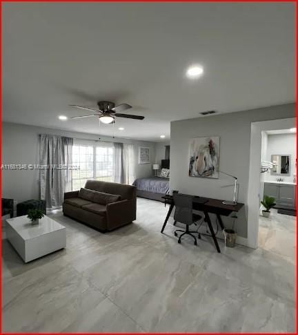 living room featuring ceiling fan